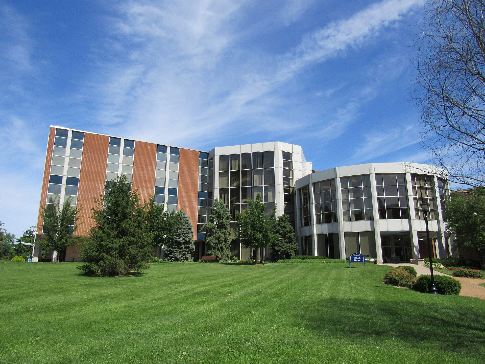 Exterior of Pius XII Memorial Library at Saint Louis University, seen across the lawn