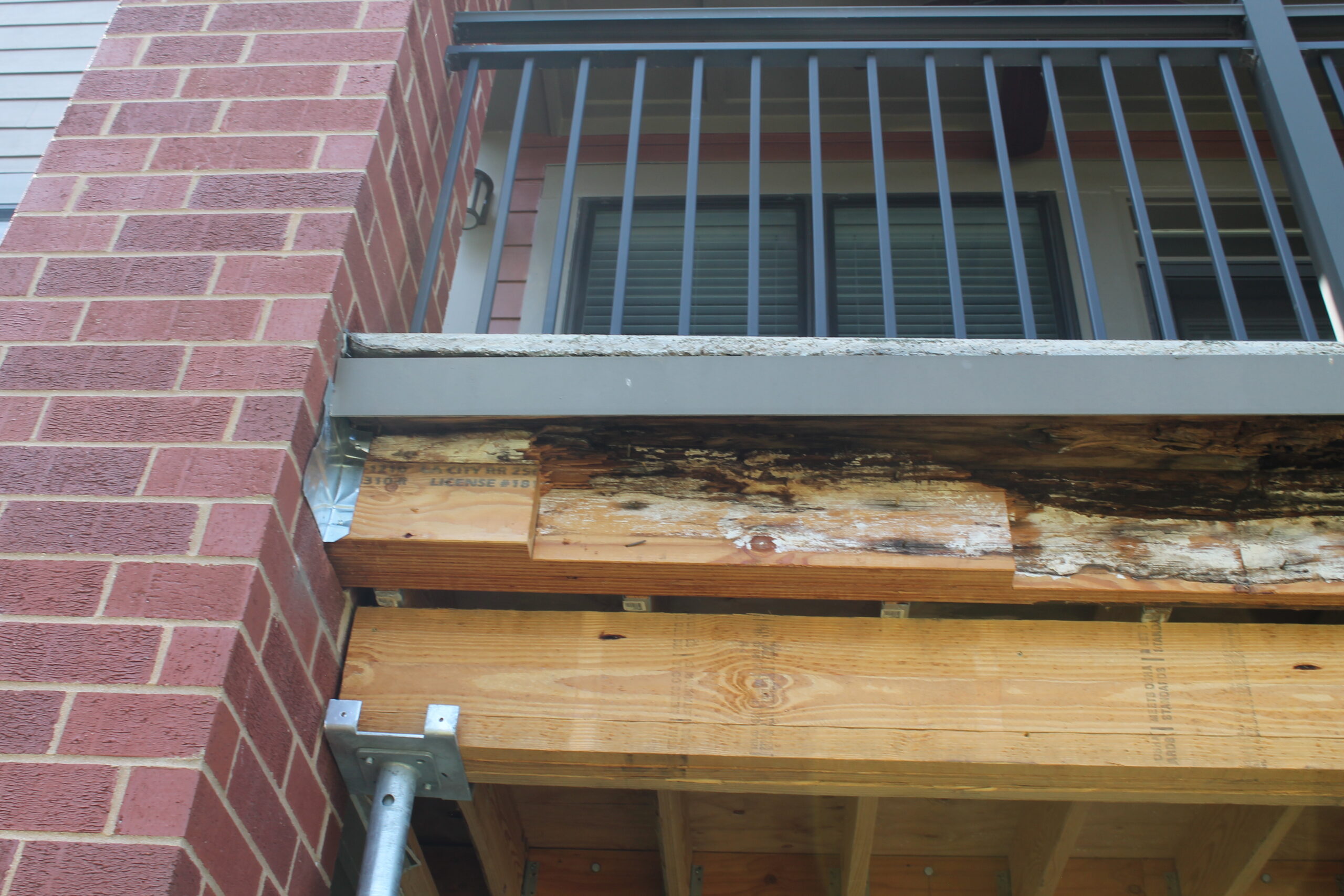 Exterior view of outside porch with moisture damage to structure.
