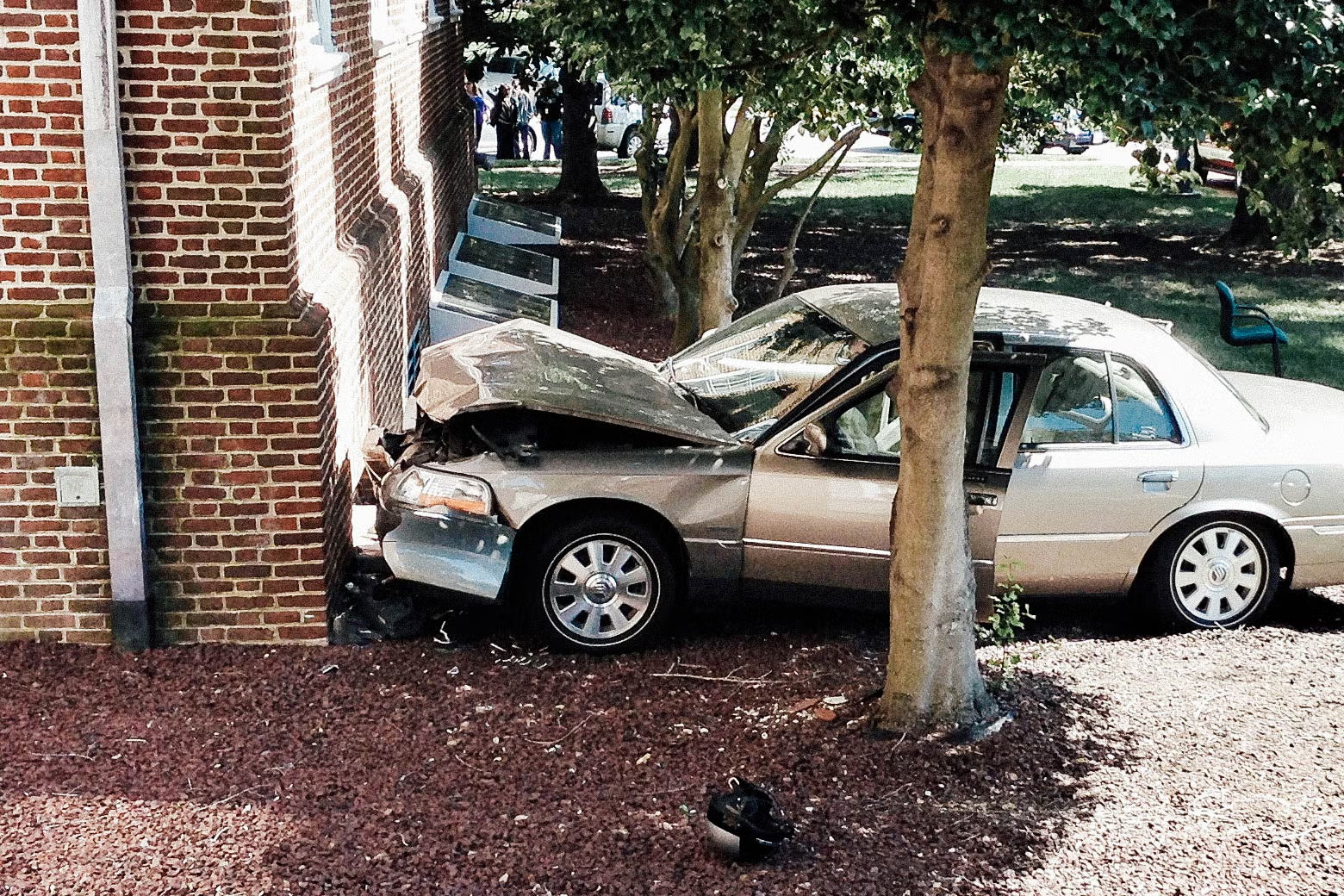 Car hitting side of building and causing structural damage.