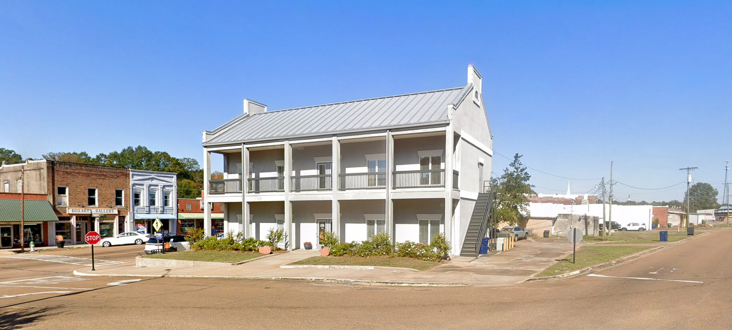Two story gray bank building in Water Valley, Mississippi