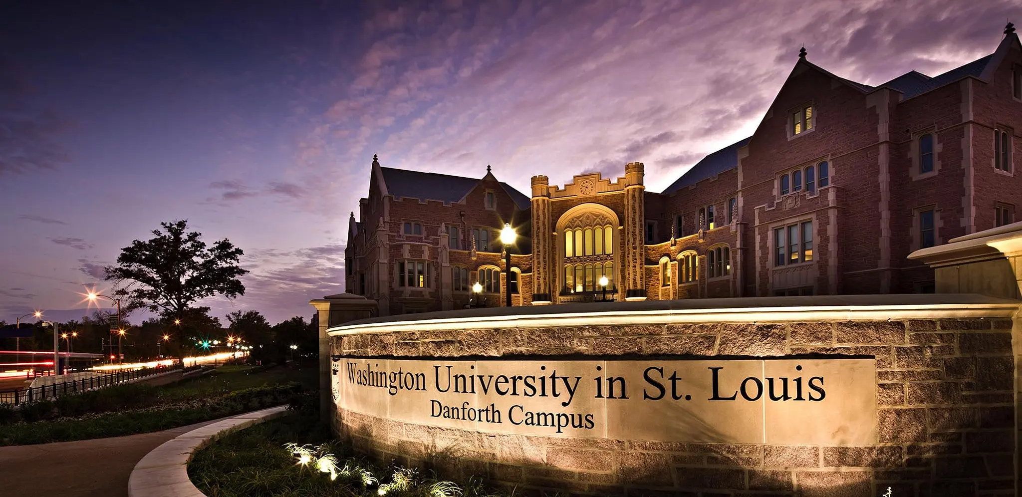 Washington University Preston Green Hall at night lit with purple sky.