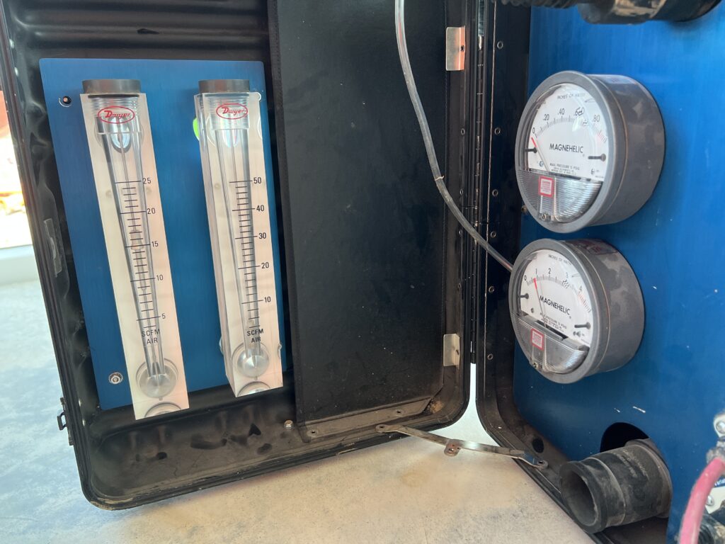 Dwyer flow meters and manometers in the test control unit used to hold pressure differential during air and water testing.