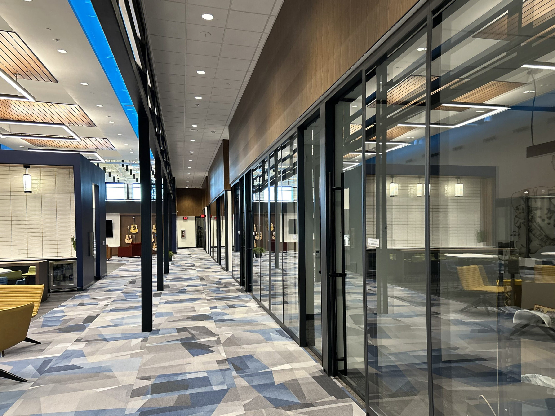 Open hallway outside glass door offices in Colorado radio station