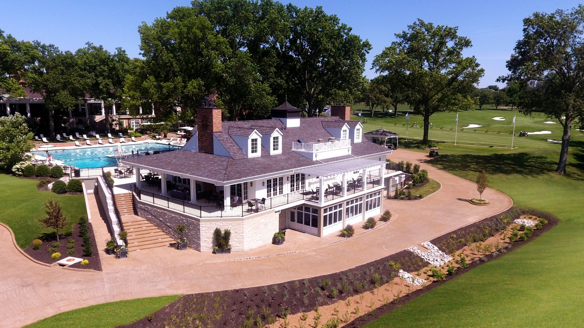 White two story renovated clubhouse at Bellerive Country Club.