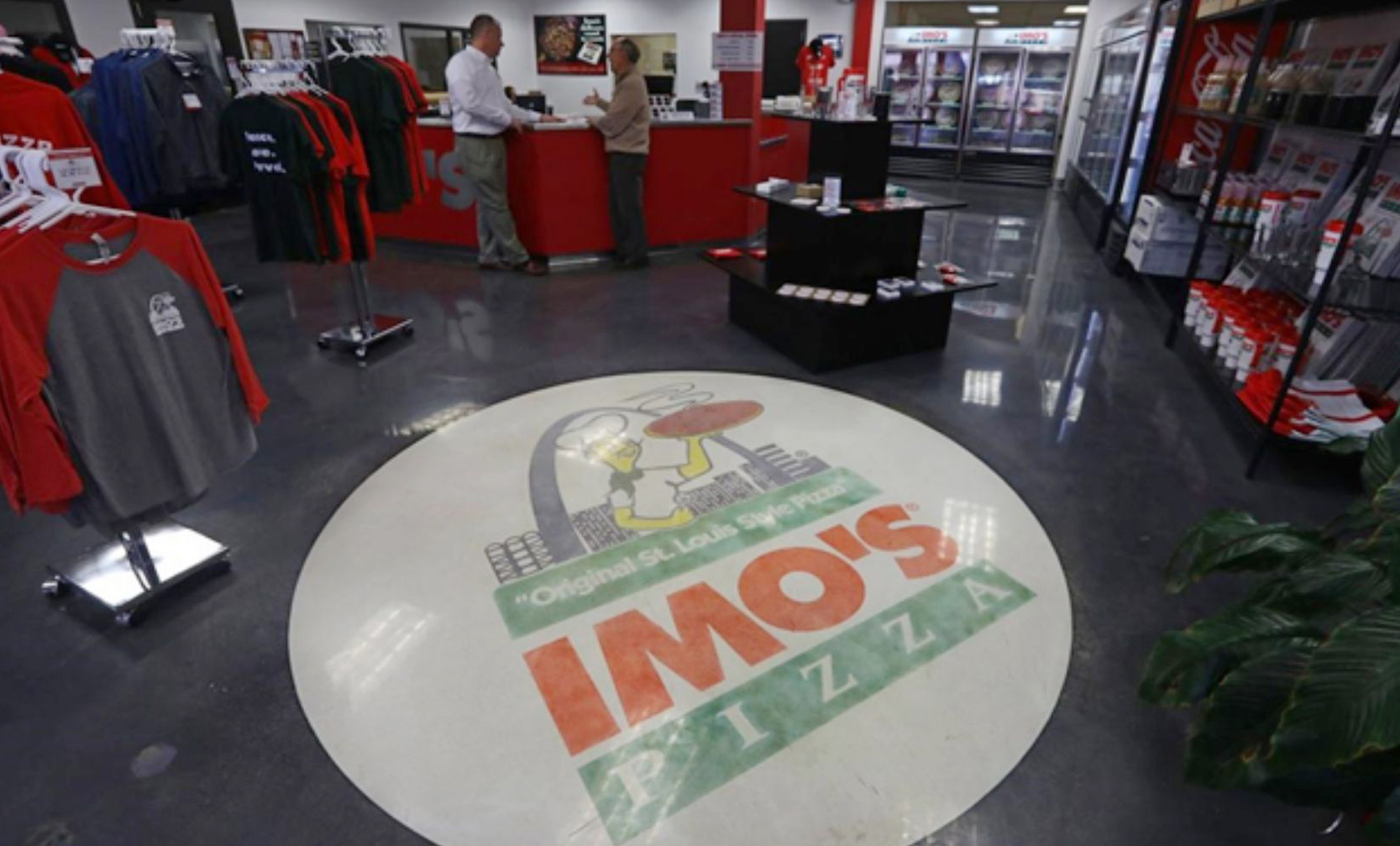 Circle Imo's pizza logo on the floor of the retail portion of the Imo's Warehouse in St. Louis