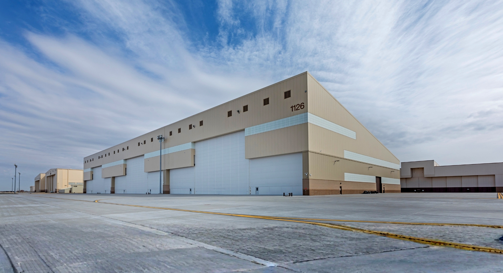 Loading Dock building with white doors and beige tin walls - at the McConnell AFB