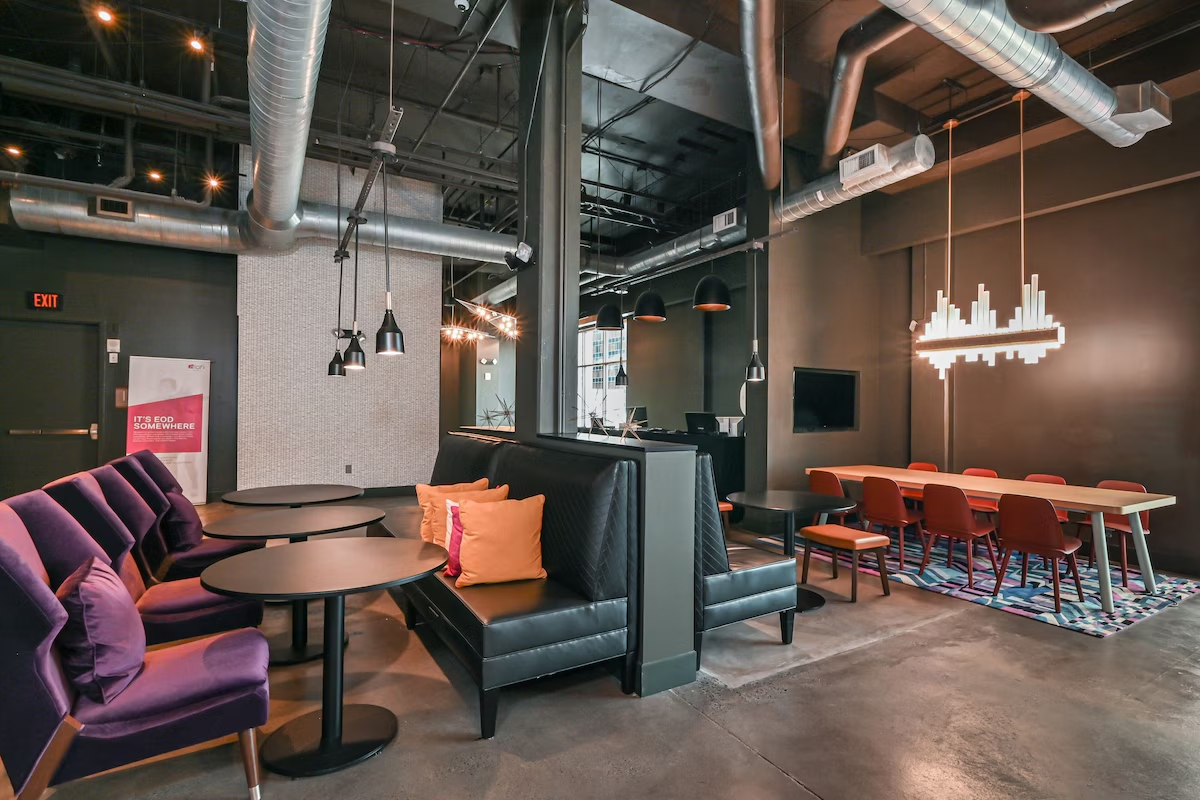 Modern industrial-chic lobby lounge and seating area at Aloft Charlotte City Center.