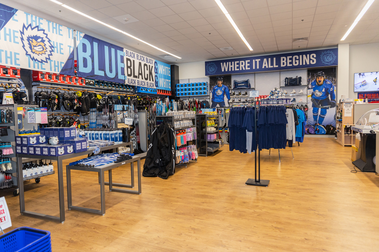 Retail store inside the Igloo Rec Ice cetner with hardwood floors and racks of branded items