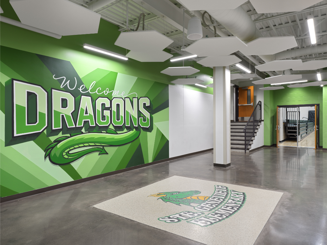 large green and white Ste. Genevieve elementary dragon illustration inside entrance to school