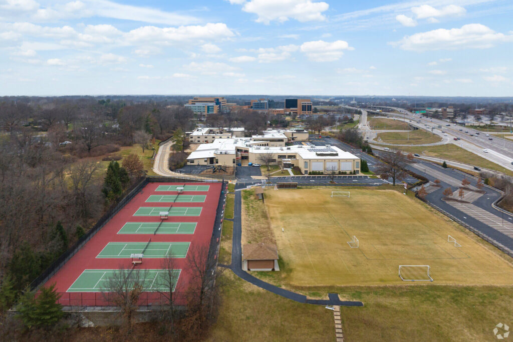 Drone footage of visitation academy campus including buildings and athletic fields