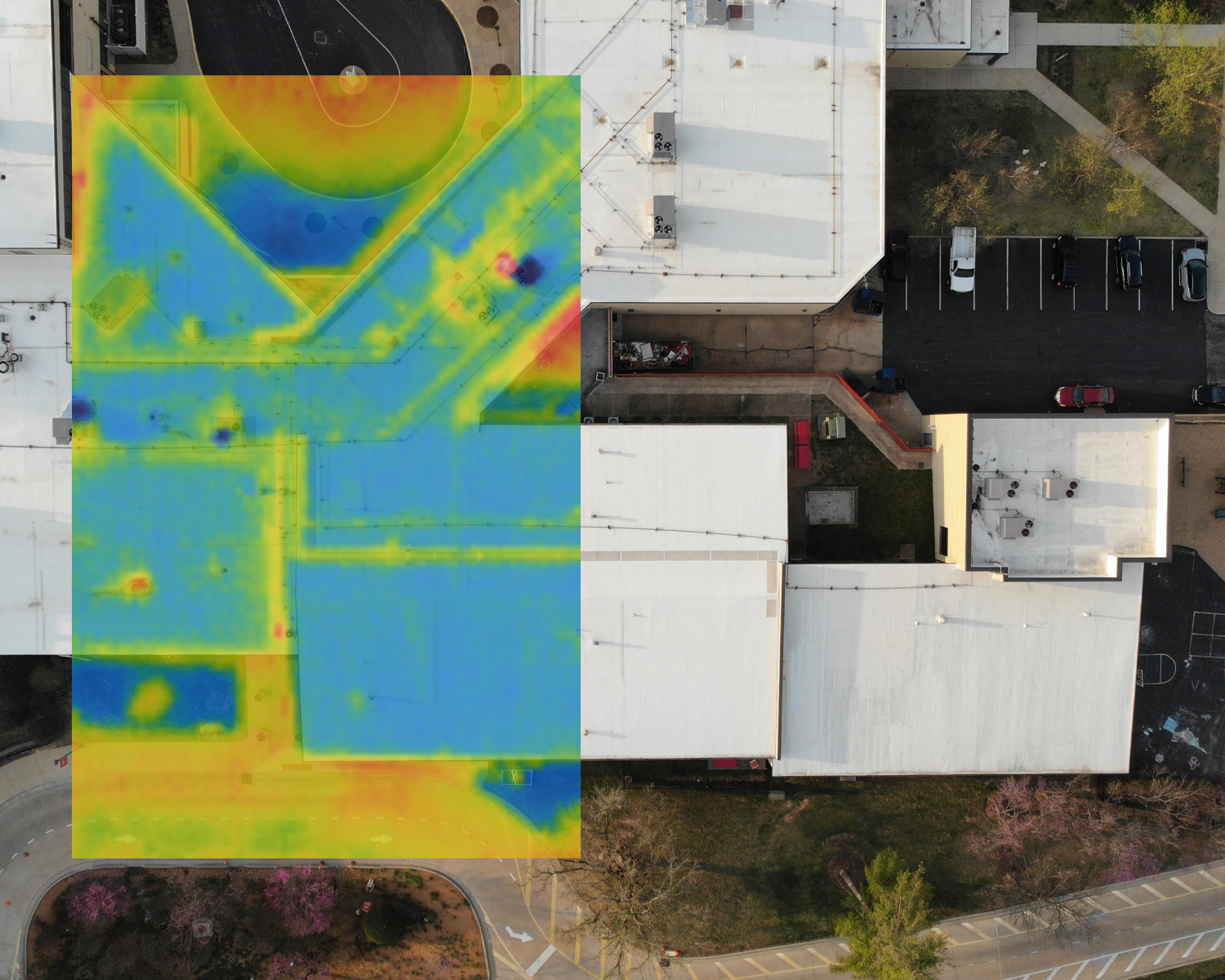 Mixed image showing plain white roof aerial view and then an overlay of the IR scan.