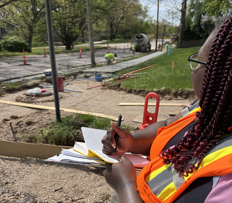 G&W civil engineer reviewing roadway grades during construction at Lindemann Road in Kirkwood, Missouri