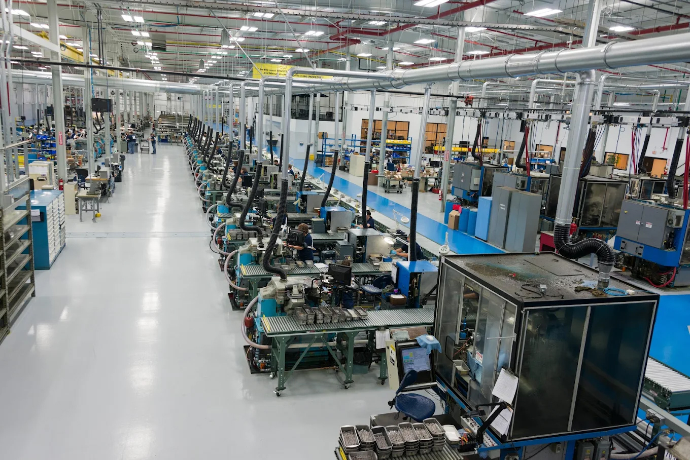 Industrial production floor with equipment in rows.