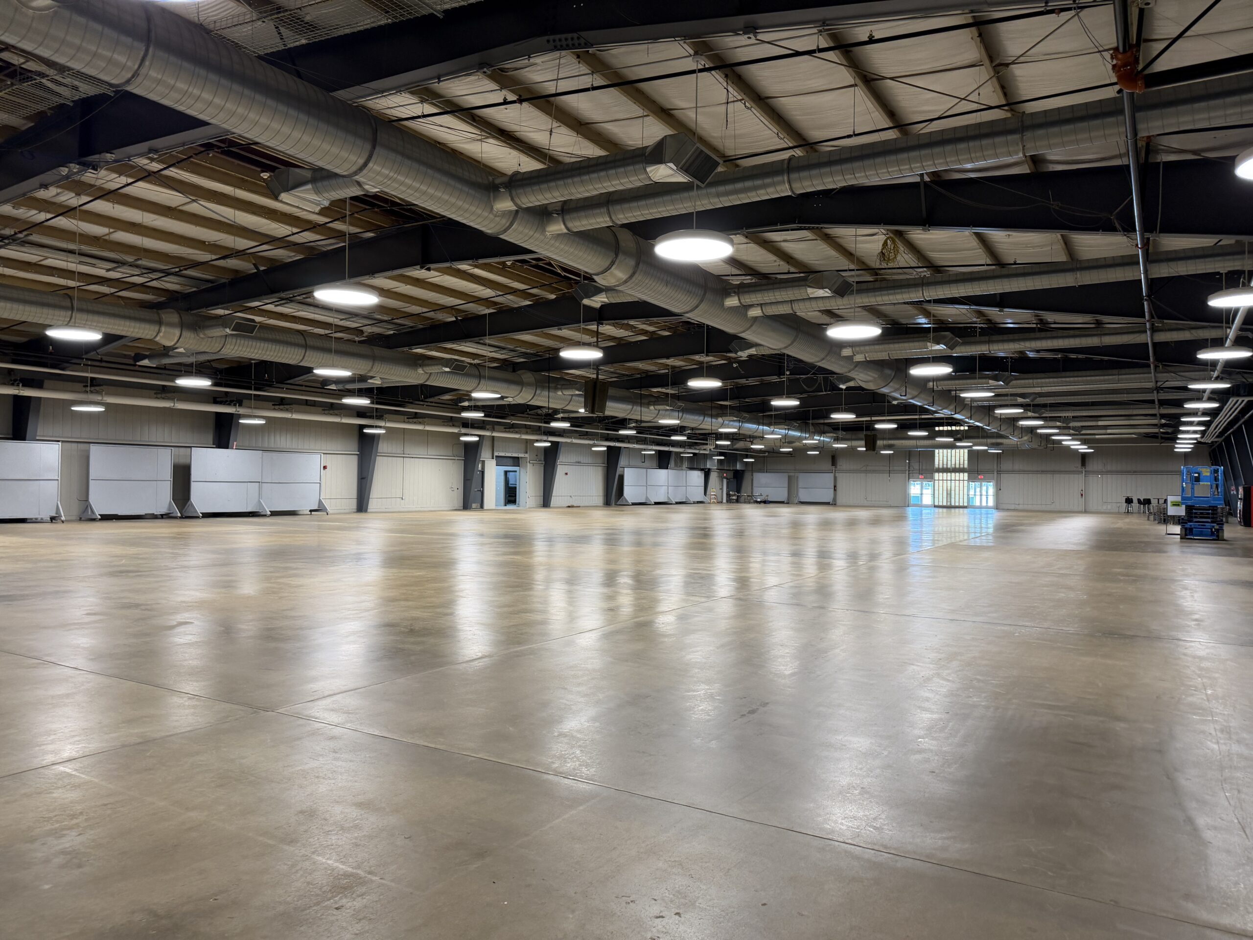 Renovated Expo Center exhibition hall at Belle-Clair Fairgrounds with new LED high bay lighting and open floor